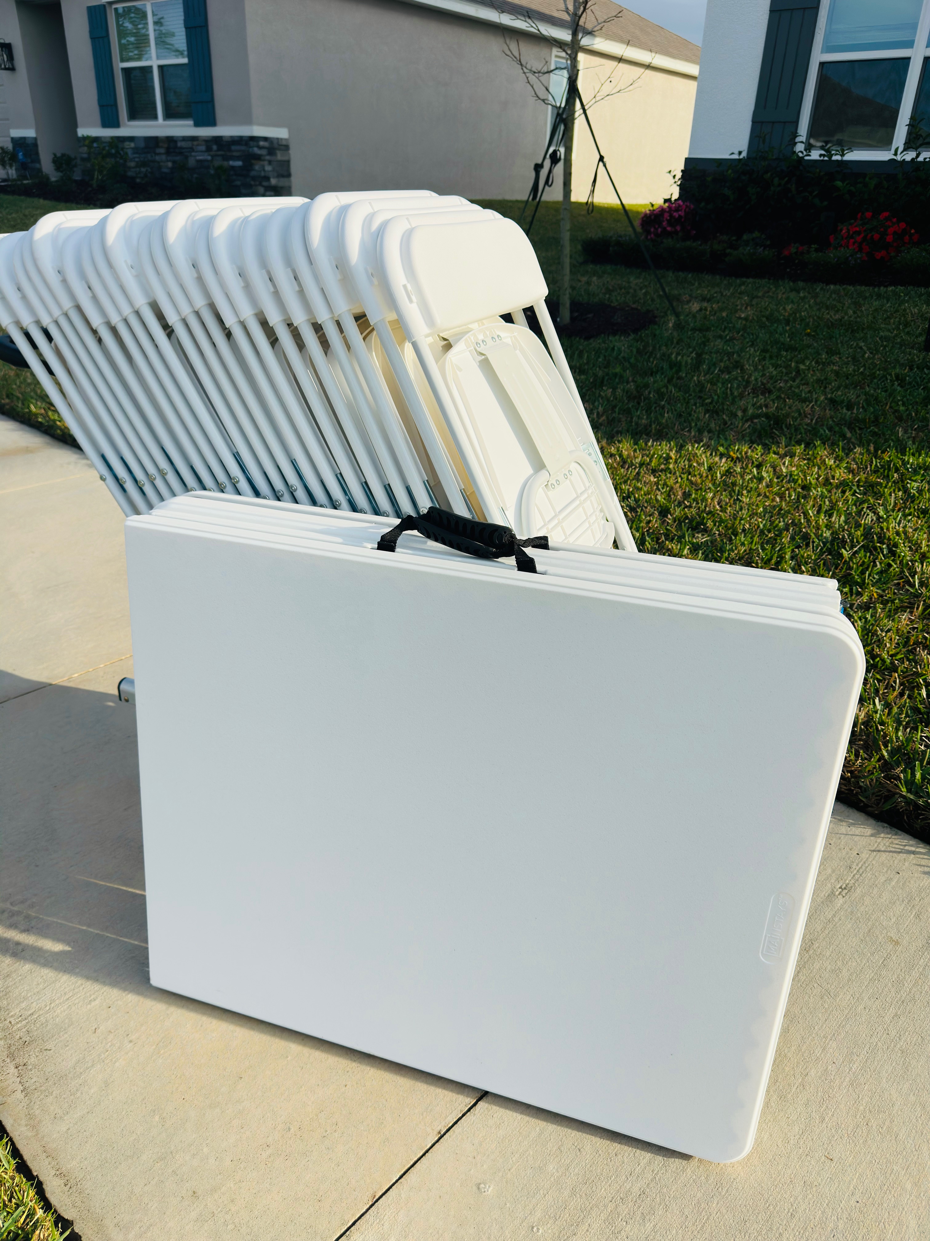 Stacked chairs and folded table ready for pickup